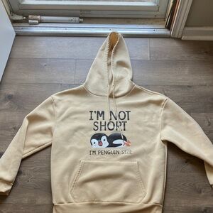 Beige Hoodie with Penguin Graphic